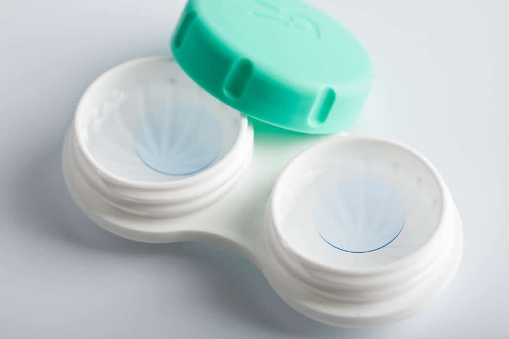 contact lenses in case with green lid